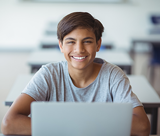Smiling student with laptop