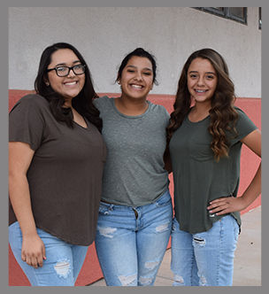 Three female students pose outside