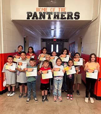 sidebargraphic_JFKElemSchool group of elementary students holding certificates